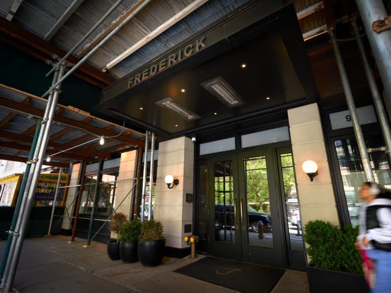 Frederick Hotel entrance in Tribeca, stylish boutique accommodation, modern updates, historic charm, welcoming atmosphere.