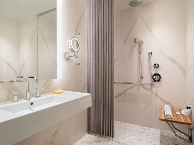 Modern bathroom with a spacious shower, sleek sink, and stylish decor, highlighting Hyatt Union Square New York's upscale amenities.