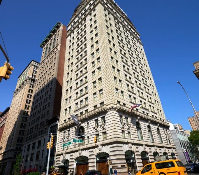 W New York – Union Square hotel exterior, historic architecture, vibrant Manhattan street, blue sky, nearby buildings, urban setting.