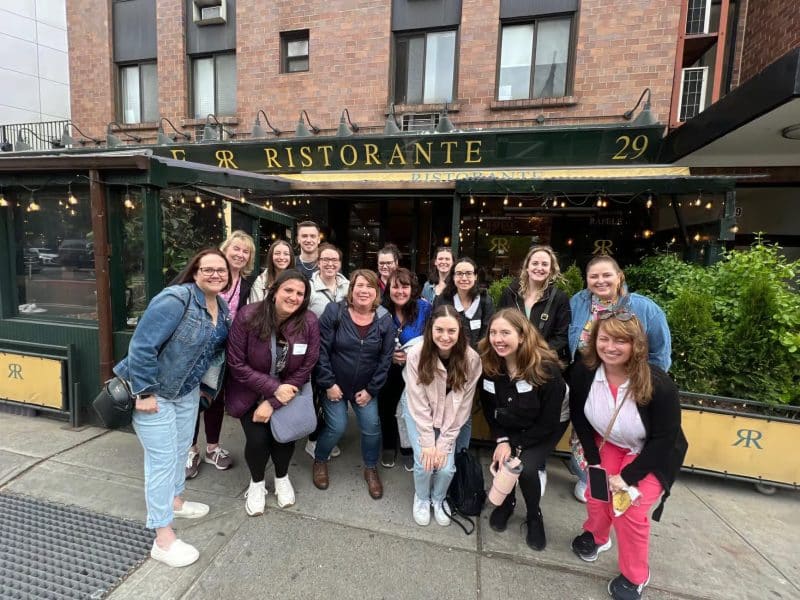 Group of enthusiastic participants in front of Ristorante, a featured restaurant on the Original Greenwich Village Food & Culture Walking Tour, showcasing NYC's culinary scene.