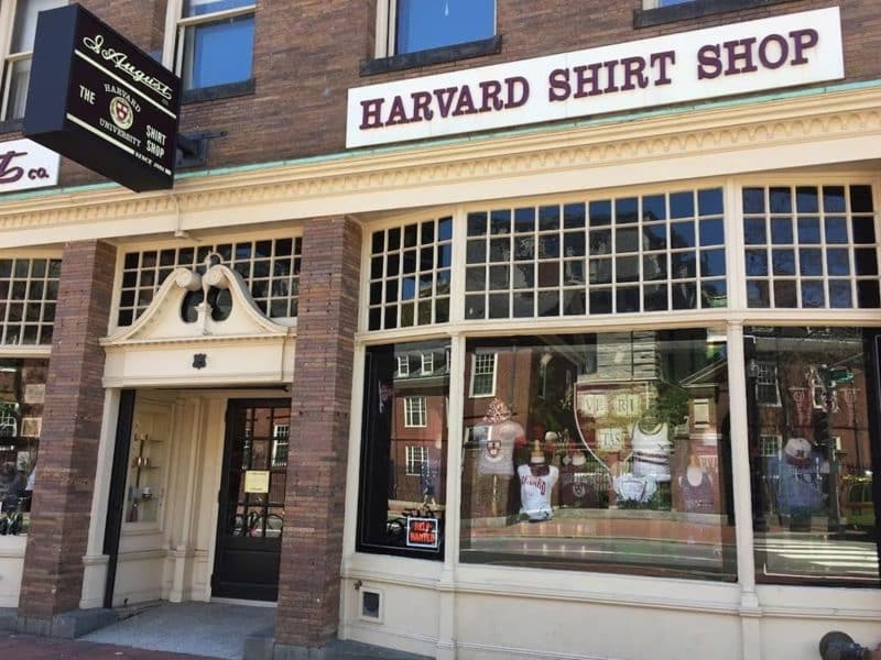 Harvard Shirt Shop storefront showcasing merchandise and iconic Harvard branding in historic Boston, reflecting the university's culture and charm.