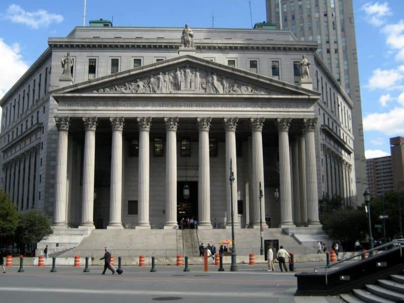 Historic courthouse building in NYC, featuring grand columns and intricate architectural details, relevant to The Godfather filming locations tour by Rosotravel.