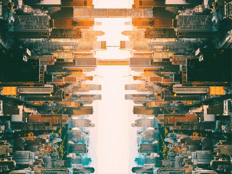 Aerial view of New York City skyline during sunset, showcasing skyscrapers and urban landscape, relevant to travel tips for visiting NYC.