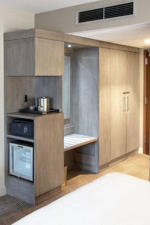 Kitchenette featuring a microwave, mini-fridge, and coffee maker, designed for convenience in hotel accommodations.