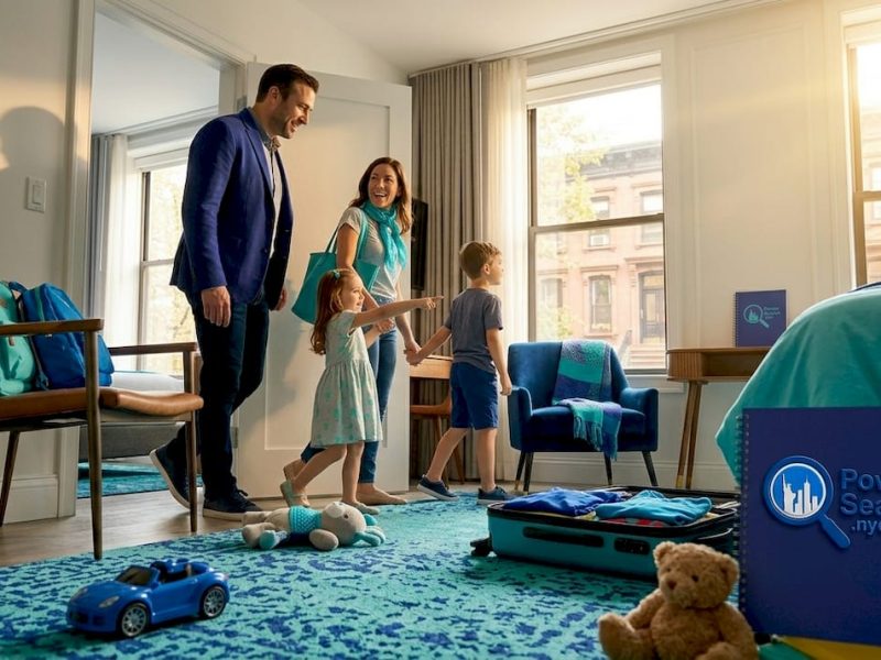Family entering connected hotel rooms in NYC