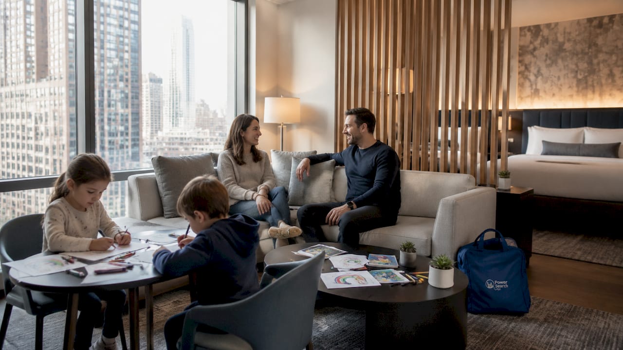 Family enjoying spacious hotel suite living area