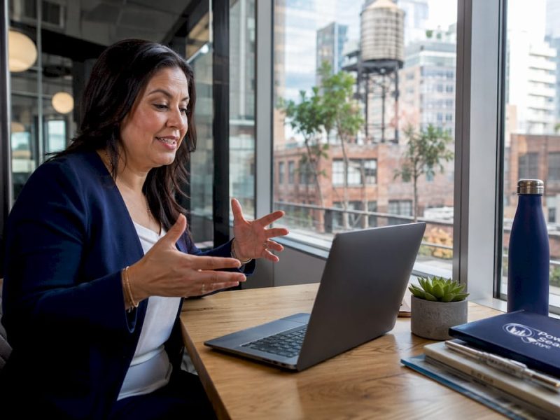 Travel agent advising client on NYC upsell options