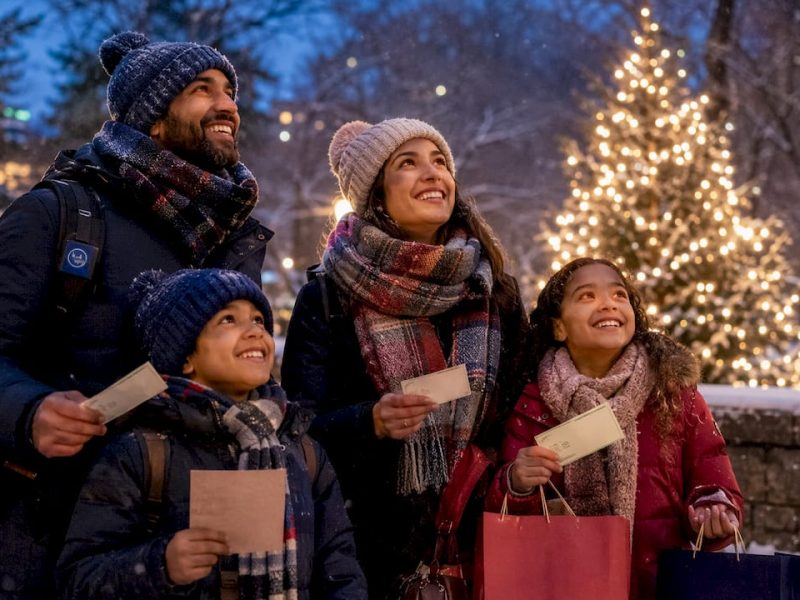 Family outside Radio City Music Hall in holiday season