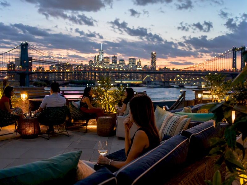 Brooklyn hotel rooftop with city skyline at twilight